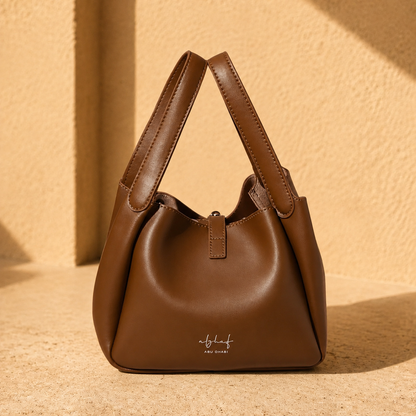 Zaya Amber leather handbag, side view, handmade by Alghaf