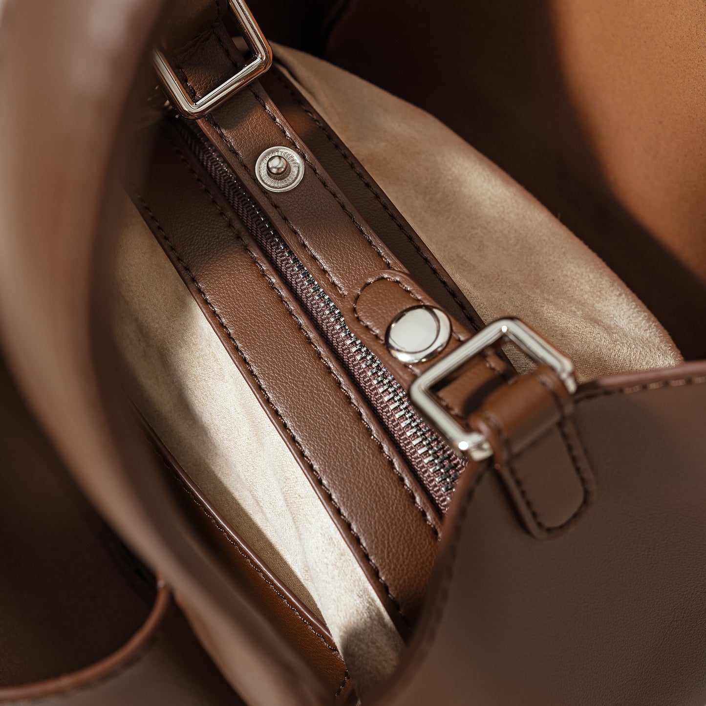 Zaya Amber leather handbag close-up showing stitching and hardware, Alghaf
