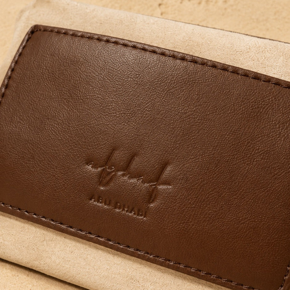 Zaya Amber leather inner pouch with Alghaf logo, handcrafted in Abu Dhabi