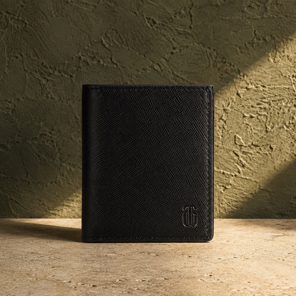 Black leather wallet with a brand logo on a textured surface and wall background